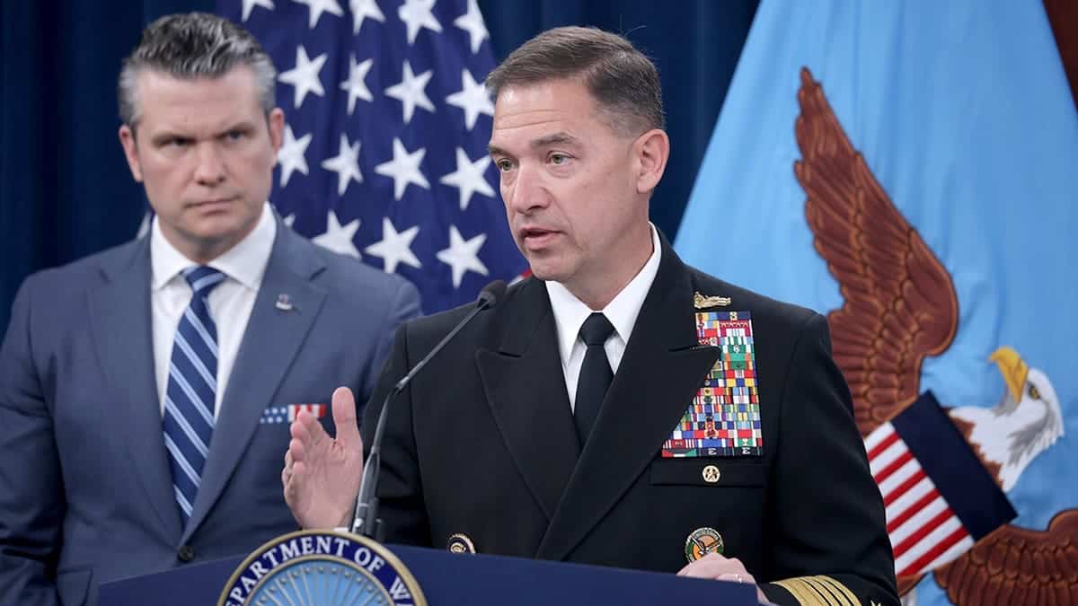 CENTCOM Commander Adm. Brad Cooper speaks as War Secretary Pete Hegseth looks in the background