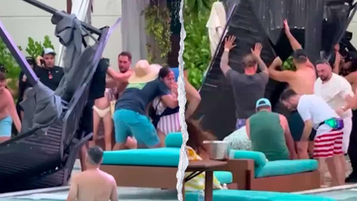 Guests and staff lift a collapsed metal cabana frame near the pool deck at the Seminole Hard Rock Hotel & Casino