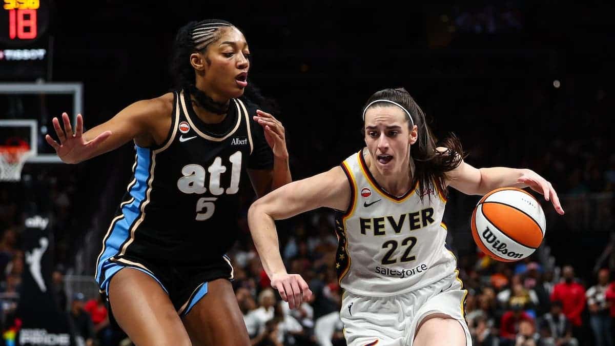 Caitlin Clark driving to the basket against Angel Reese at State Farm Arena in Atlanta