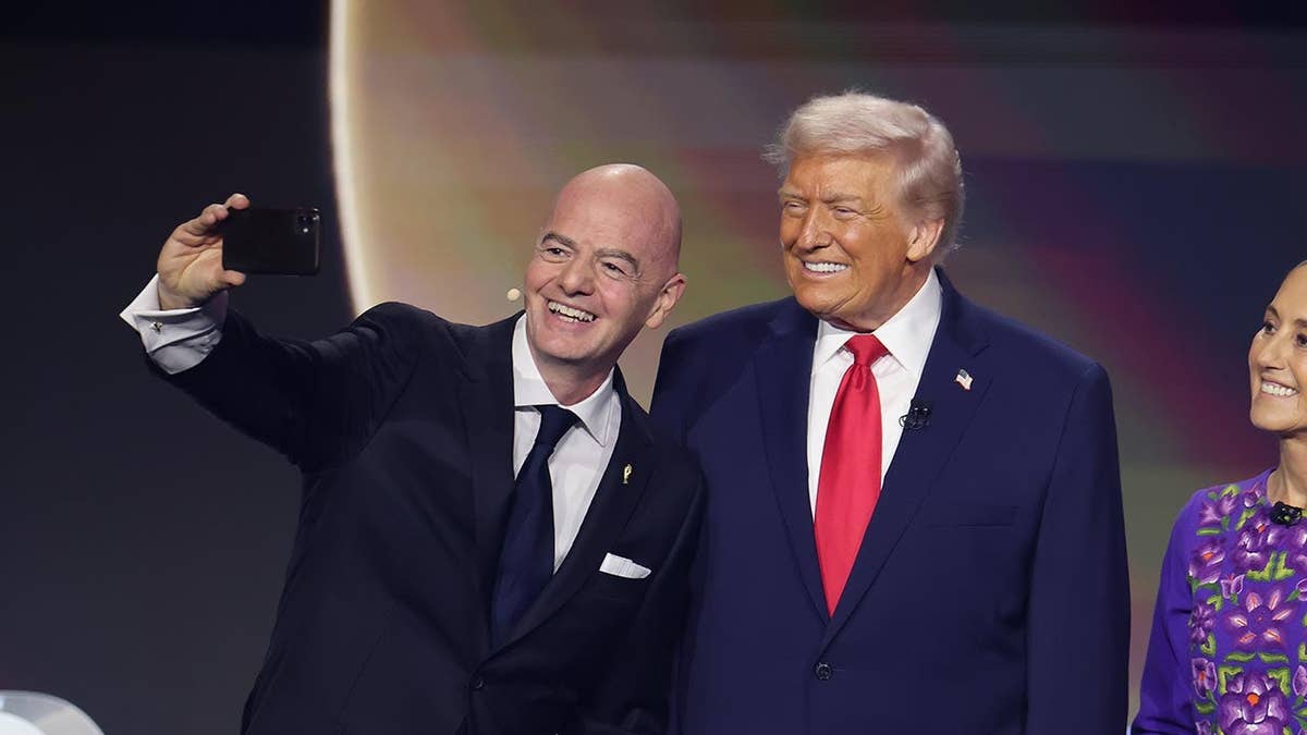 U.S. President Donald Trump and Gianni Infantino pose for a selfie with Claudia Sheinbaum and Mark Carney at the FIFA World Cup 2026 draw.