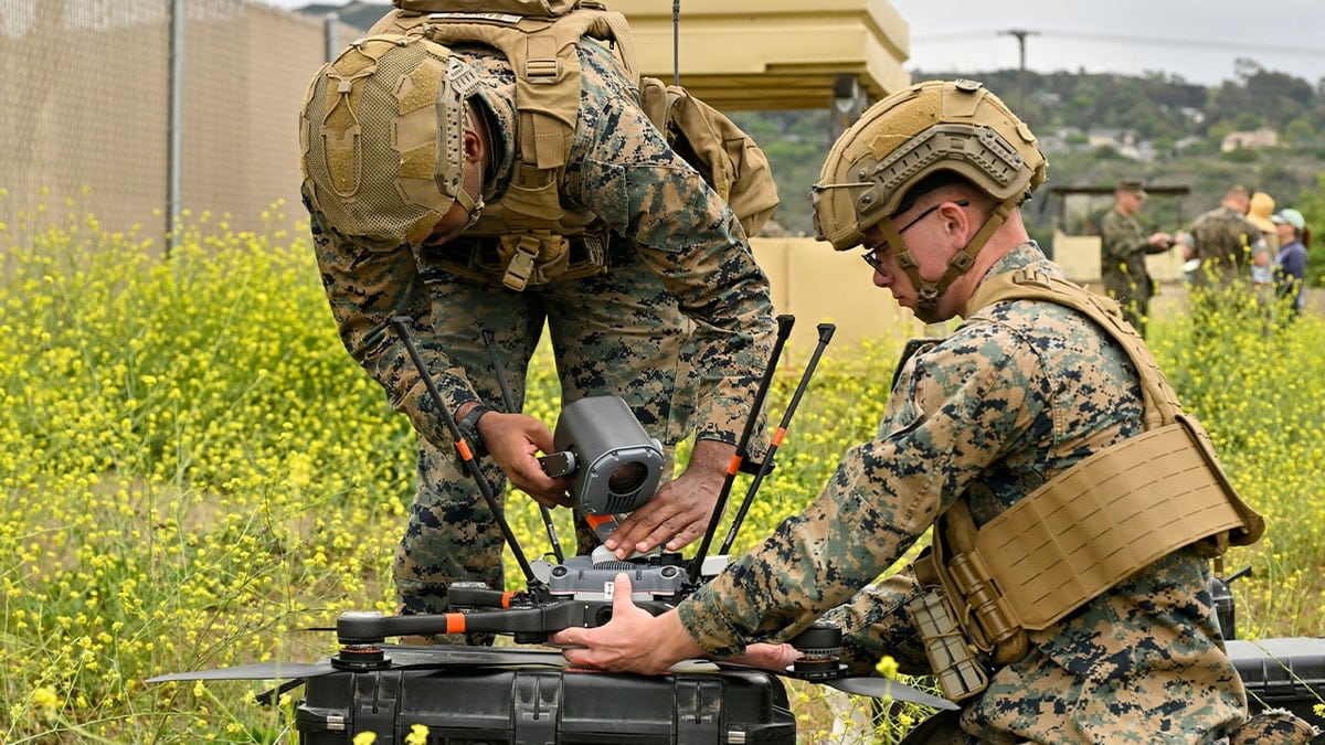 Camp Pendleton, CA - June 06: Corporals Nathan Baptiste, left, and Jacob Bennett attach a camera to an observation UAV during tactical scenario training of offensive and defensive drone capabilities at Camp Pendleton on Friday, June 6, 2025. (Photo by Jeff Gritchen/MediaNews Group/Orange County Register via Getty Images)