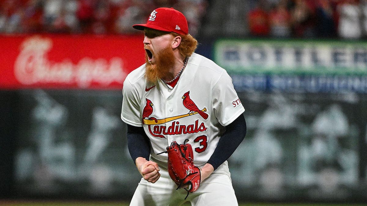 Dustin May pitching for St. Louis Cardinals at Busch Stadium.