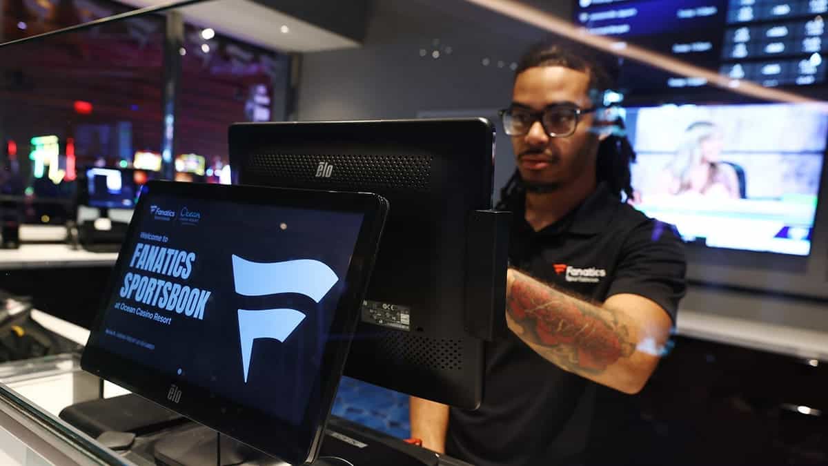 A team member standing inside the Fanatics Sportsbook at Ocean Casino Resort in Atlantic City, New Jersey.