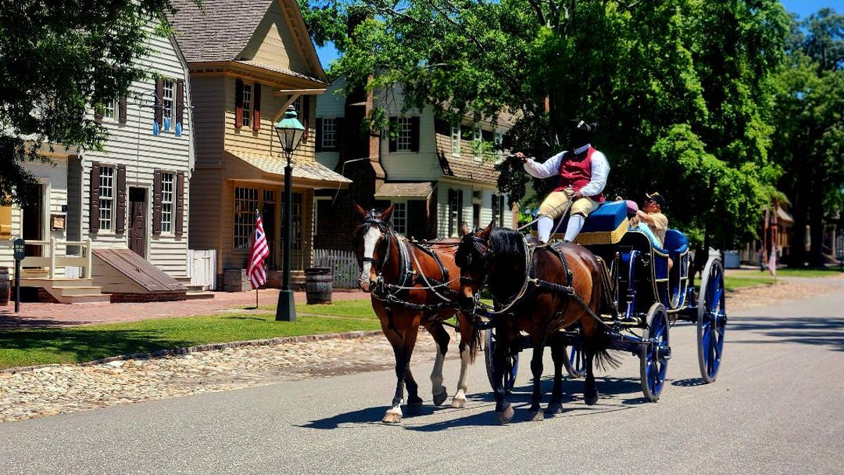 A horse and carriage rolls through Williamsburg.
