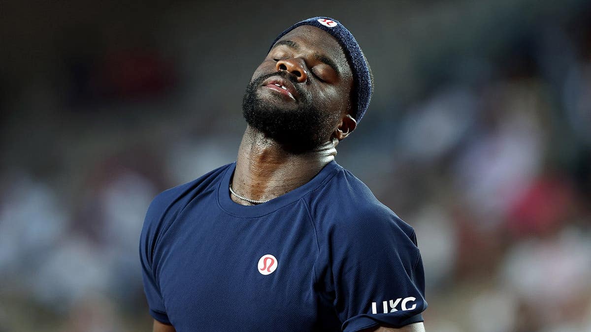 Frances Tiafoe reacting during a tennis match against Matteo Arnaldi at the French Open.