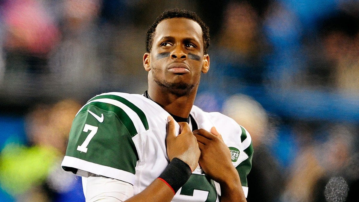 Geno Smith of the New York Jets watching the scoreboard at Bank of America Stadium.