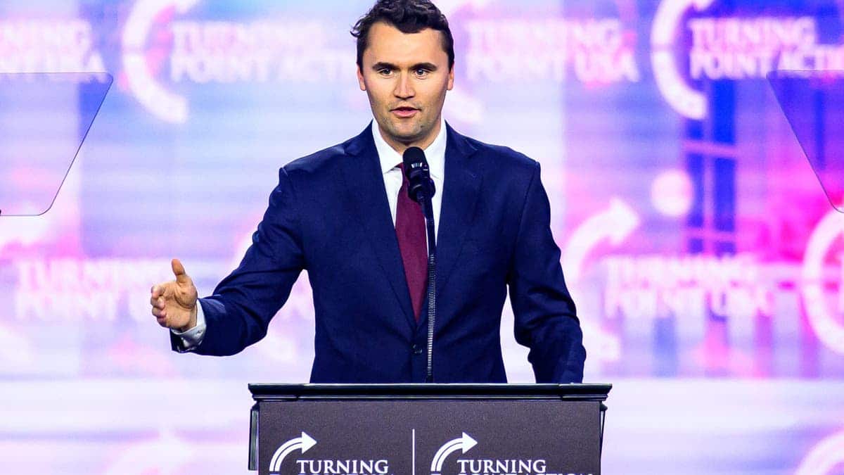 Charlie Kirk speaking on stage at America Fest 2024 in Phoenix, Arizona