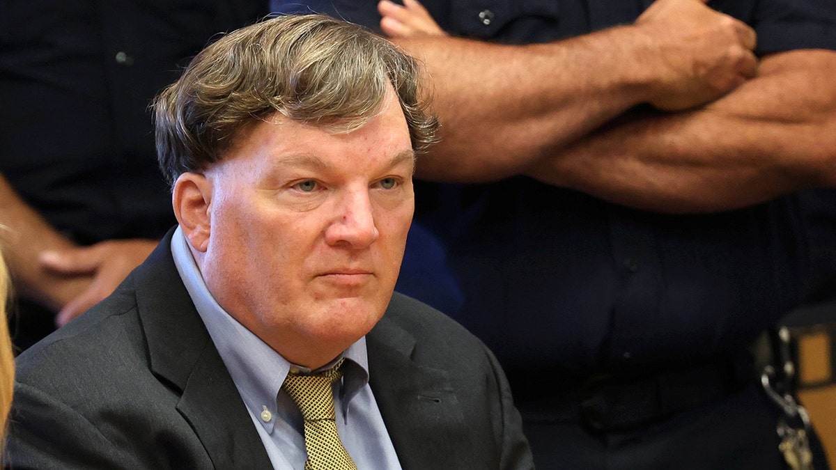 Rex Heuermann standing inside a courtroom at Suffolk County Court in Riverhead, New York