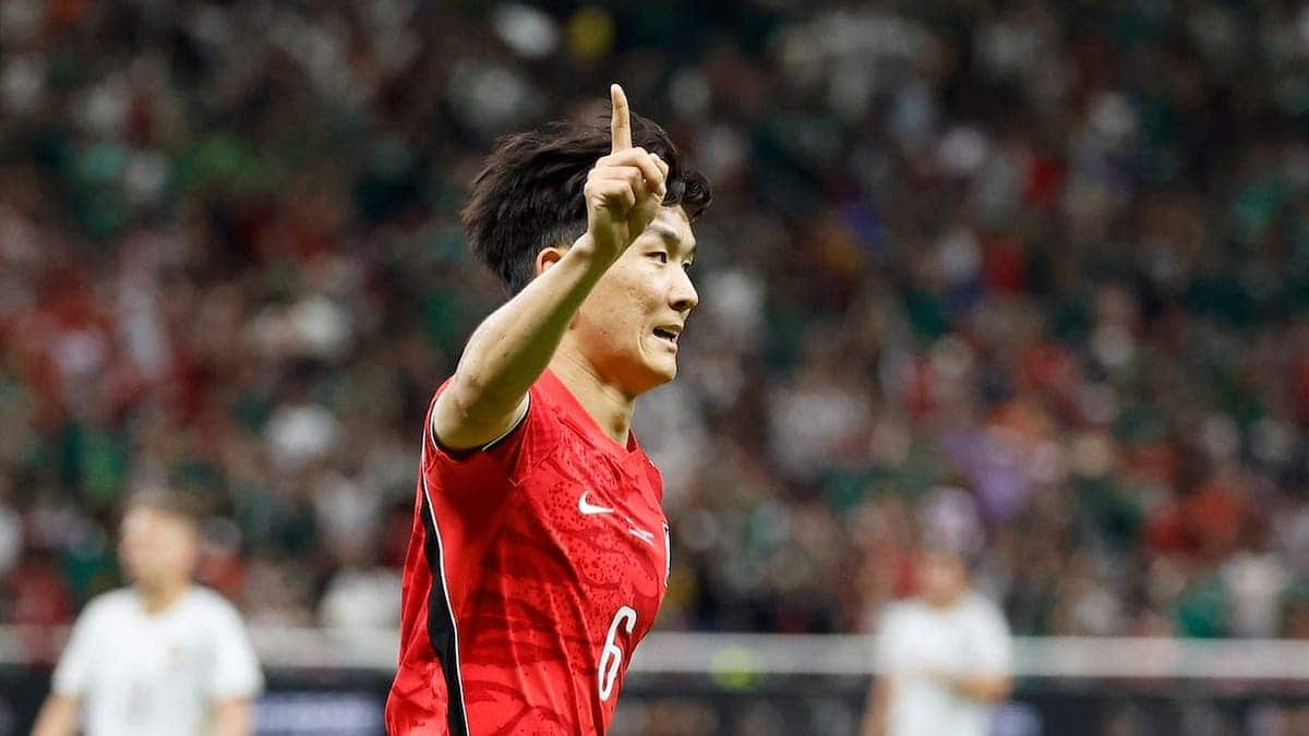 South Korea midfielder Hwang In-beom celebrating after scoring a goal during a football match.