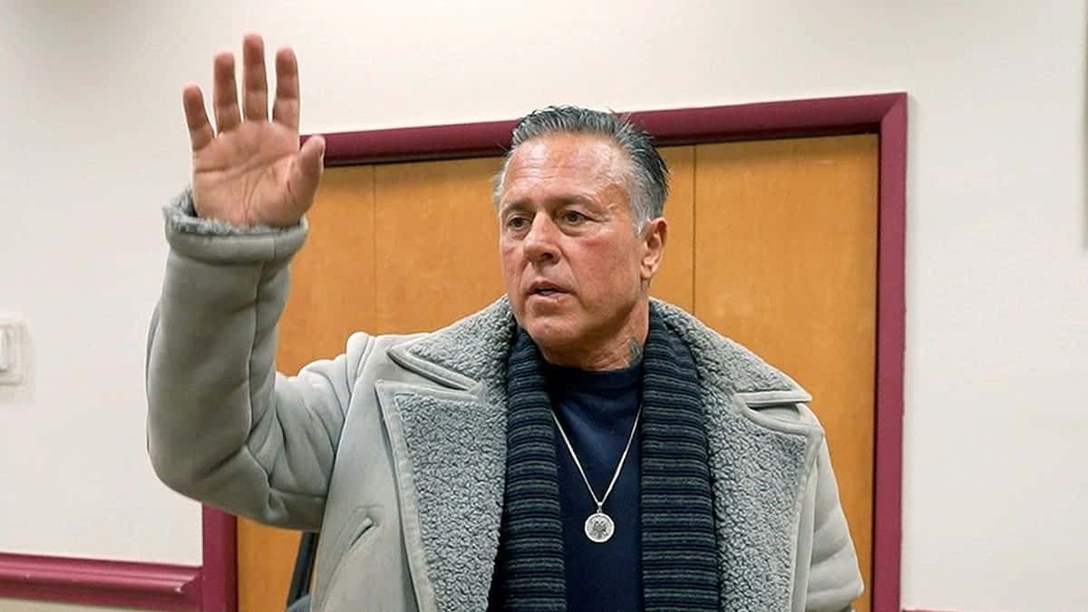Englishtown Councilman John Alite waving as he leaves the Municipal Building.