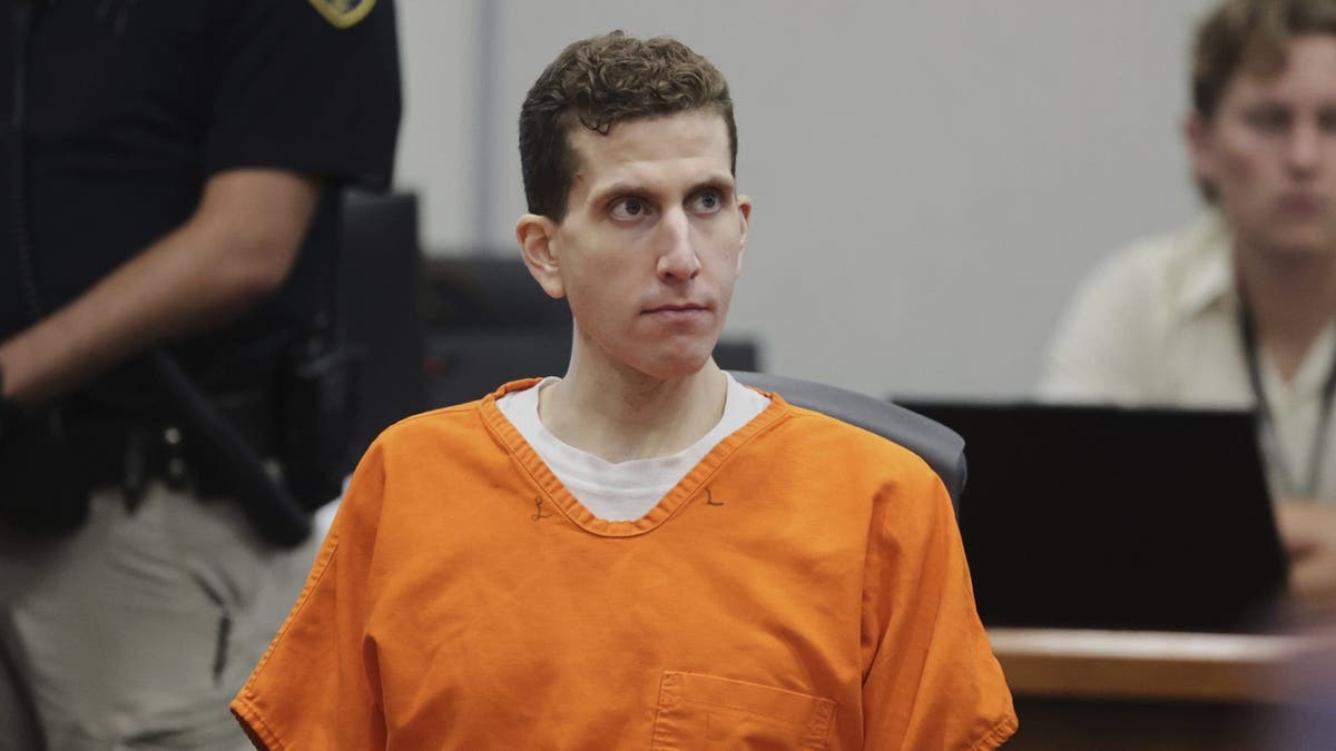 Bryan Kohberger leaning back in courtroom wearing orange jail jumpsuit