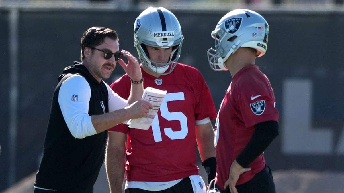 Las Vegas Raiders offensive coordinator Andrew Janocko talks with quarterbacks Fernando Mendoza and Kirk Cousins at minicamp