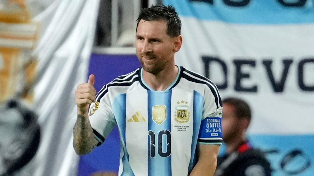 Argentina's Lionel Messi reacts after scoring his third goal during a soccer match in Kansas City