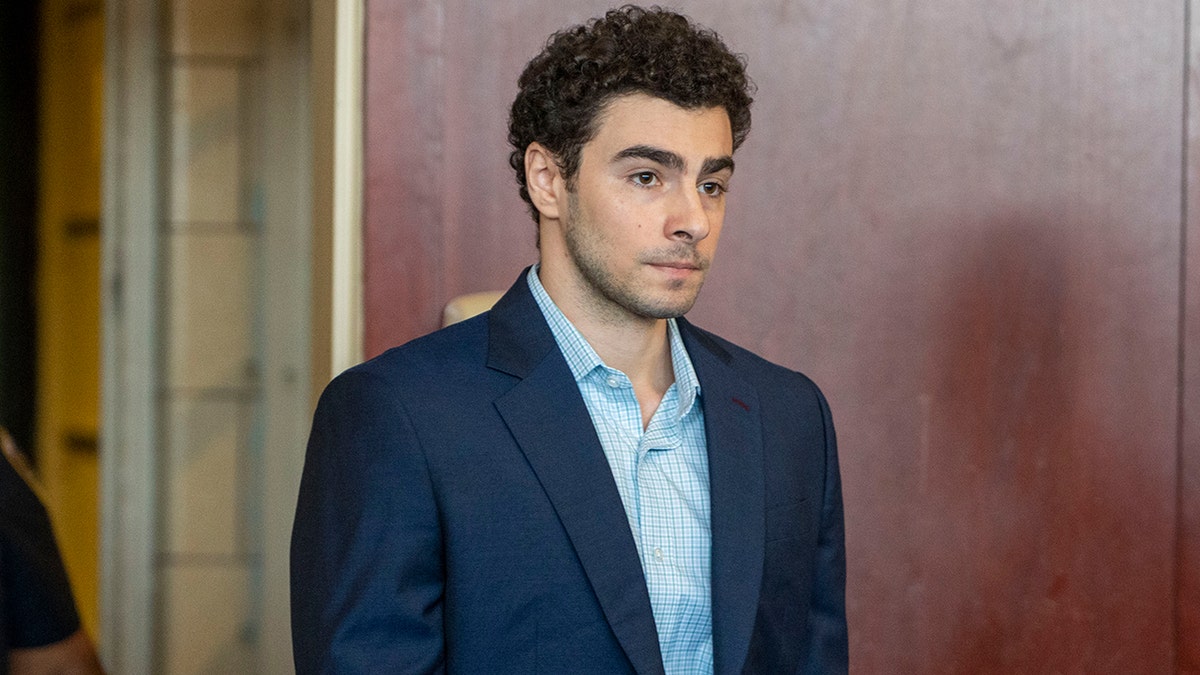 Luigi Mangione speaking at an evidence suppression hearing in a Manhattan Supreme Court courtroom