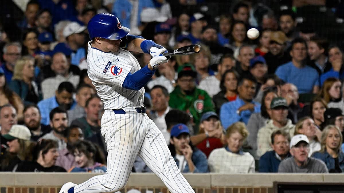 Chicago Cubs third baseman Matt Shaw singles during a baseball game at Wrigley Field