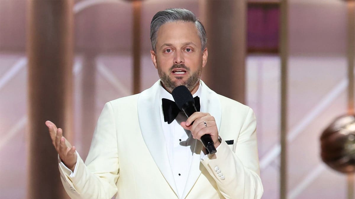 Comedian Nate Bargatze standing on stage at the Golden Globes in Beverly Hills