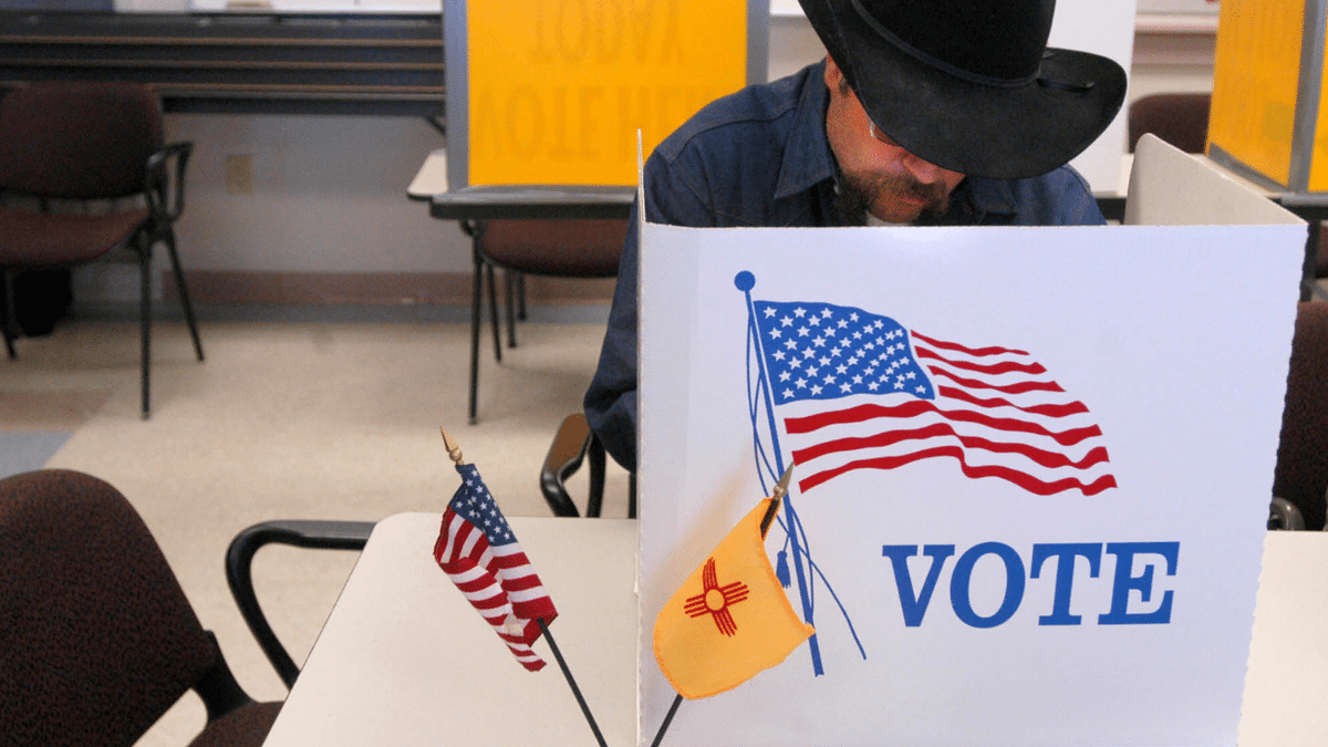 A man is seen casting a voter at a New Mexico polling site.