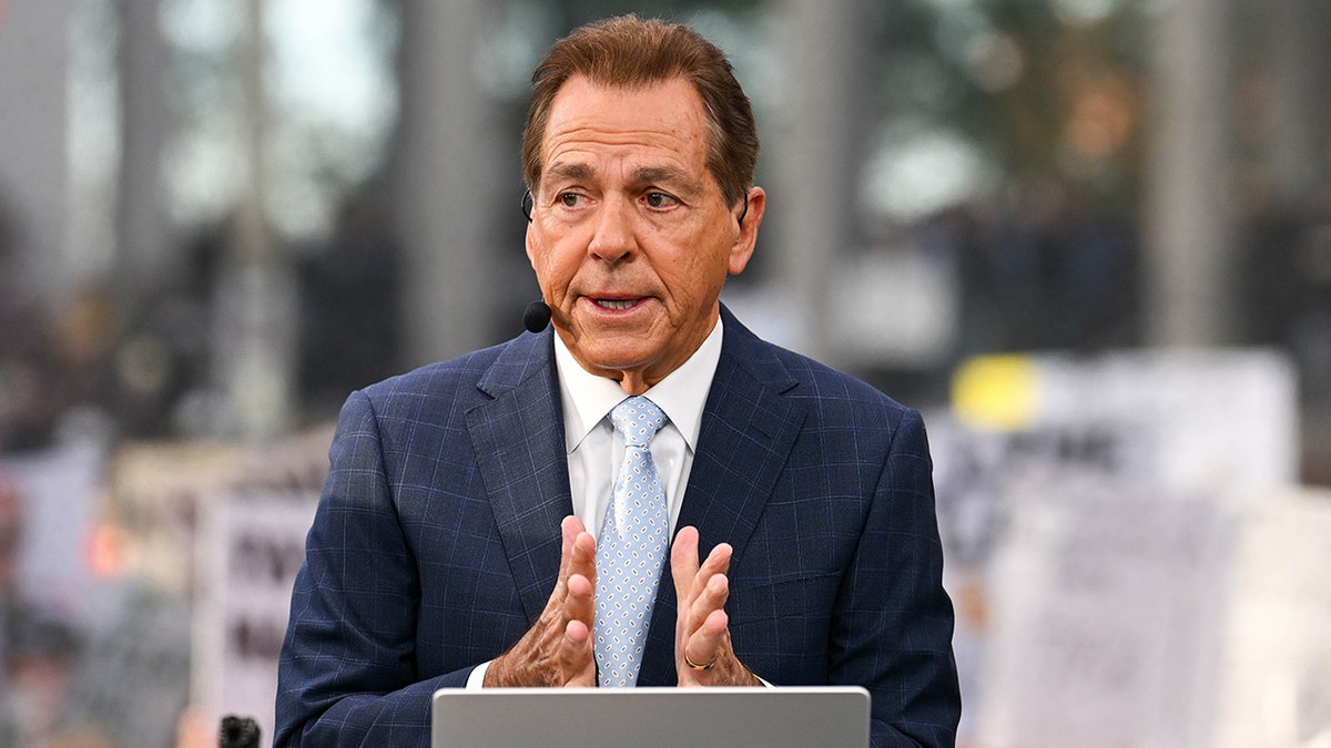Nick Saban speaking on a TV set during ESPN College GameDay at Vanderbilt University
