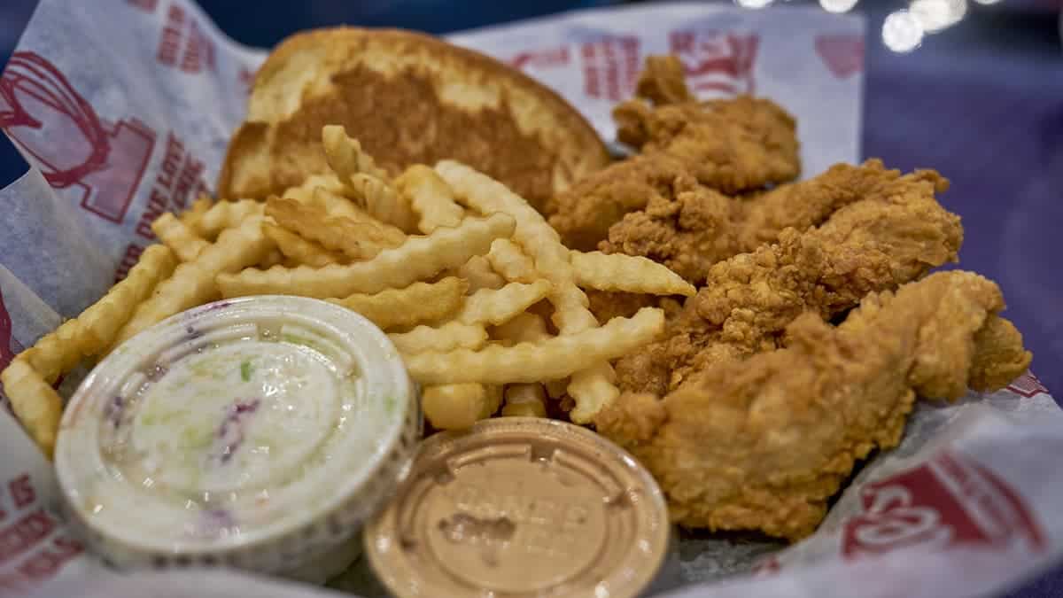 A combo meal from Raising Cane's featuring a side of coleslaw.