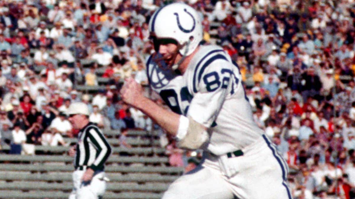 Baltimore Colts receiver Raymond Berry running with football against Los Angeles Rams at Memorial Coliseum