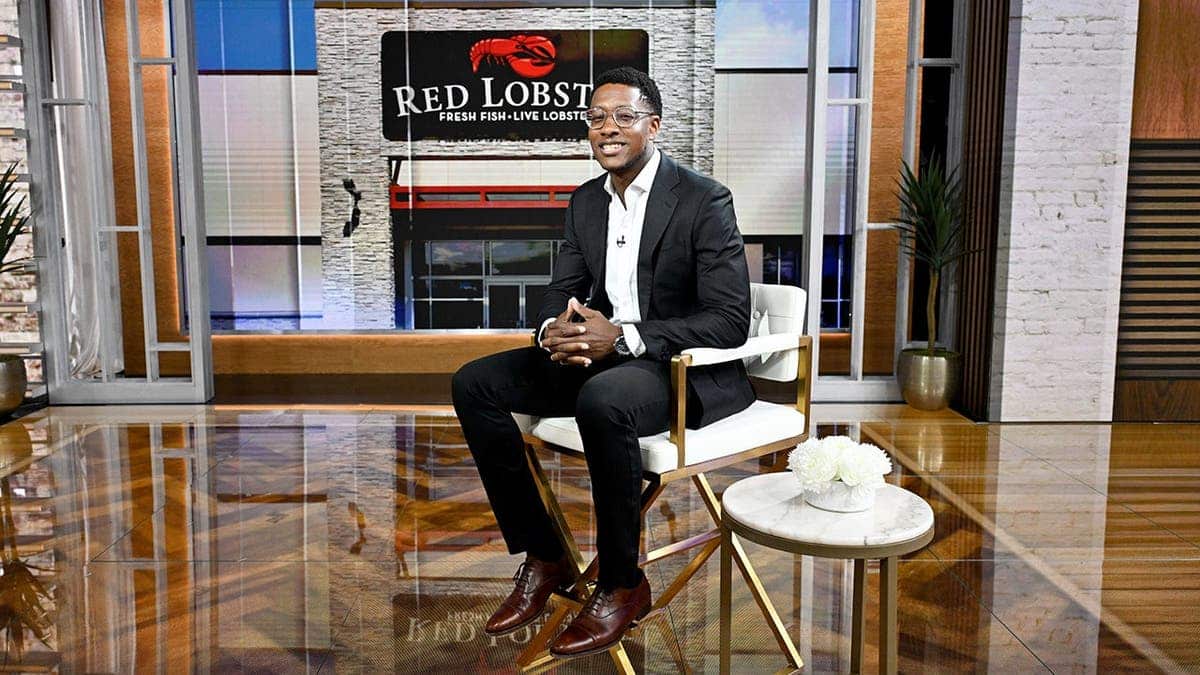 Damola Adamolekun sits on the set of