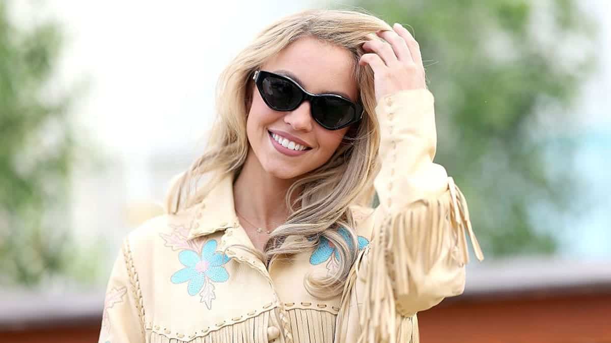 Sydney Sweeney posing backstage at the Stagecoach Festival in Indio, California