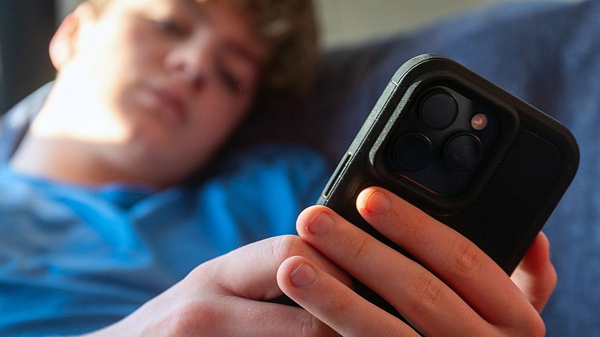 Teenager using a cellphone