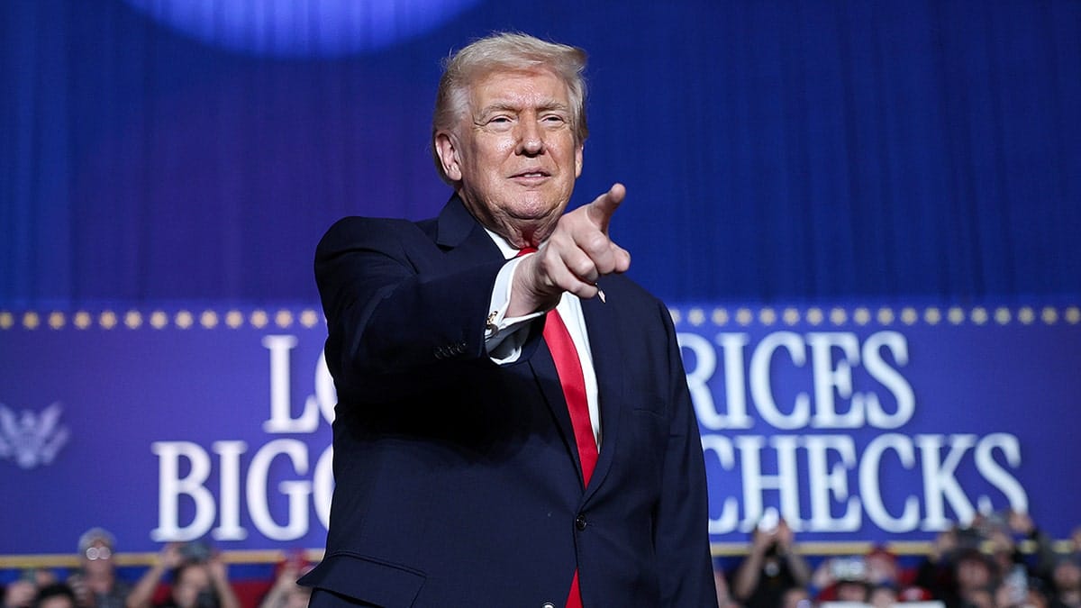 U.S. President Donald Trump speaking on stage at a rally in Clive, Iowa