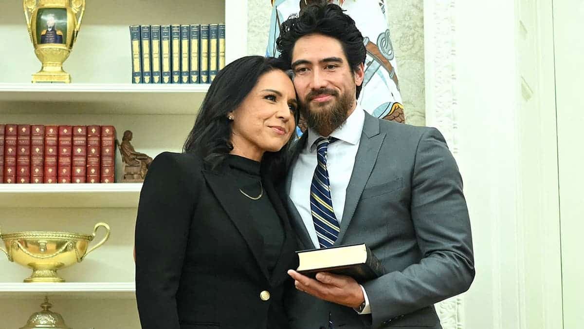 Tulsi Gabbard embraces husband Abraham Williams after swearing-in ceremony.