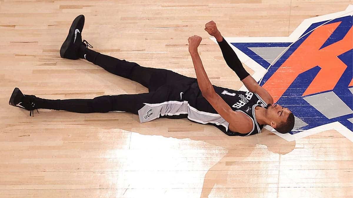 Victor Wembanyama #1 of the San Antonio Spurs reacts after shooting a three point basket