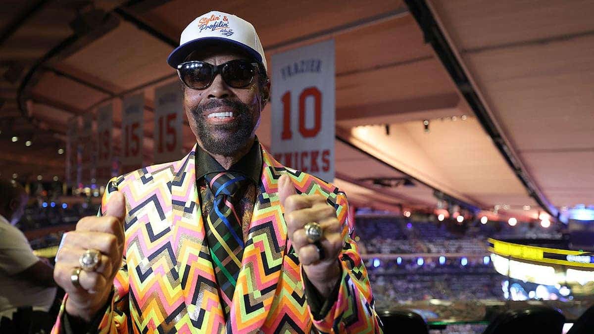 Walt Frazier posing at Madison Square Garden before NBA Finals game.
