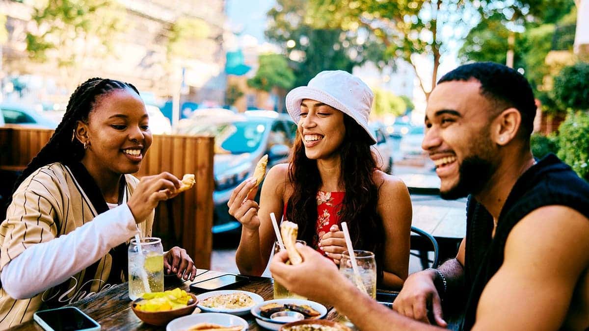 A group of friends enjoys each other's company at a dinner party.