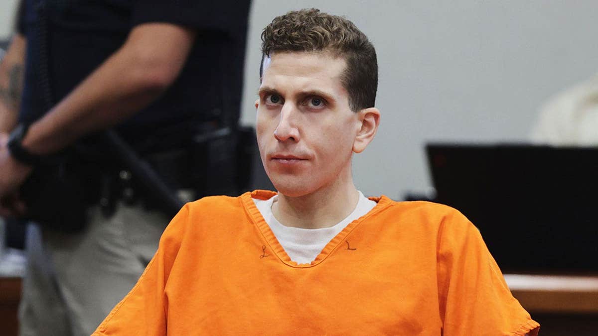 Bryan Kohberger staring wearing a orange jumpsuit.
