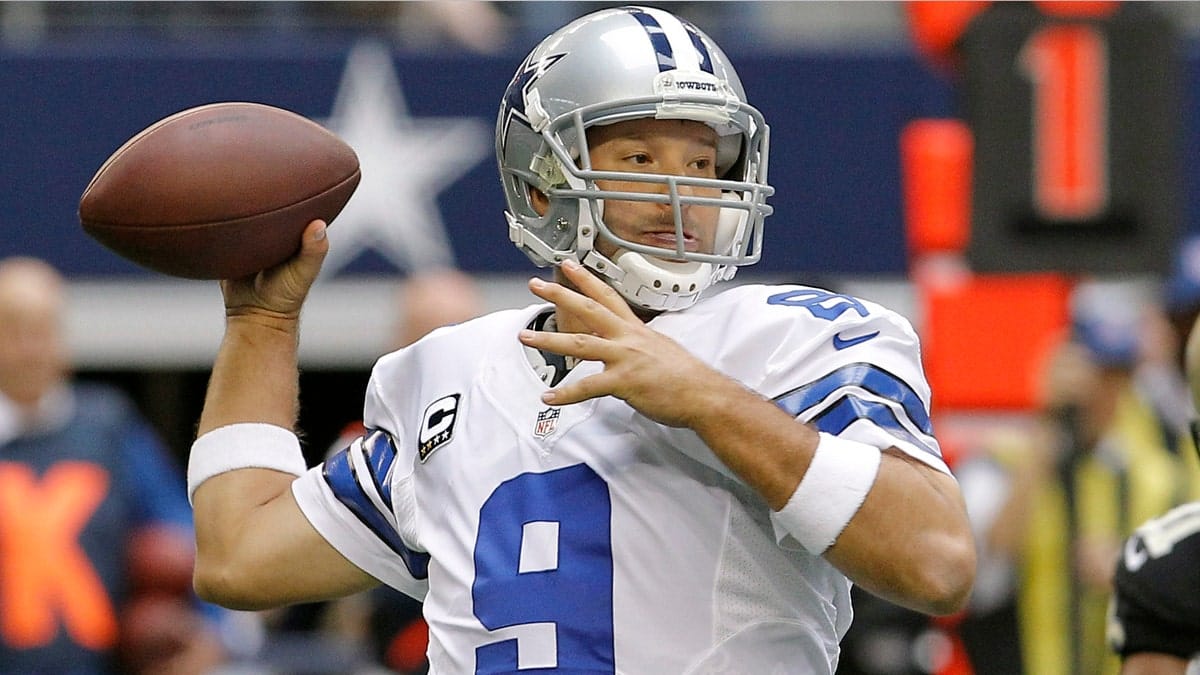 FILE - In this Dec. 23, 2012 file photo, Dallas Cowboys quarterback Tony Romo (9) passes the ball against the New Orleans Saints during the first half of an NFL football game in Arlington, Texas. Romo will miss at least three weeks of offseason workouts after a procedure to remove a cyst from his back. The team's website reported Tuesday, May 21, 2013 that Romo underwent the procedure last month and could return for the mandatory minicamp that starts June 11. (AP Photo/Brandon Wade, File)