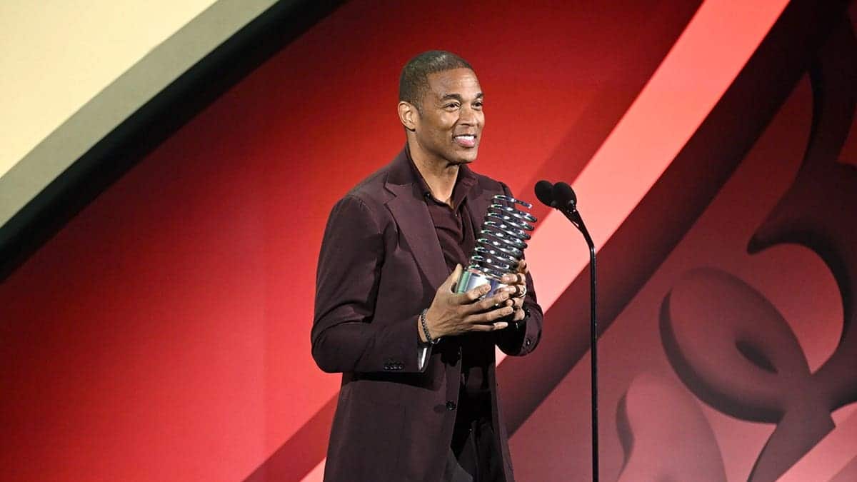 Don Lemon accepts an award onstage at the Webby Awards