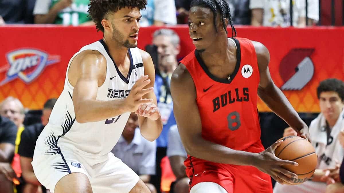 Caleb Wilson is guarded by Cameron Boozer during an NBA Summer League game.