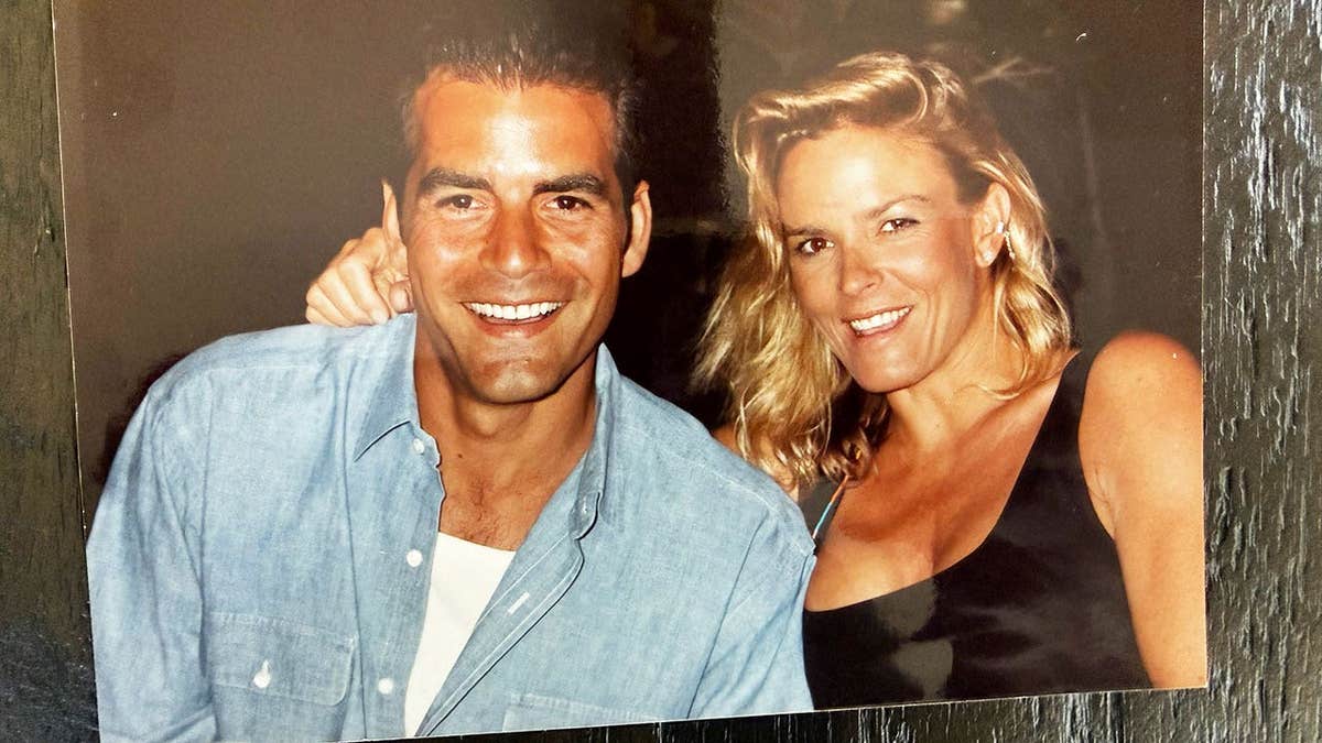Joseph Perrulli and Nicole Brown Simpson smiling for a portrait.