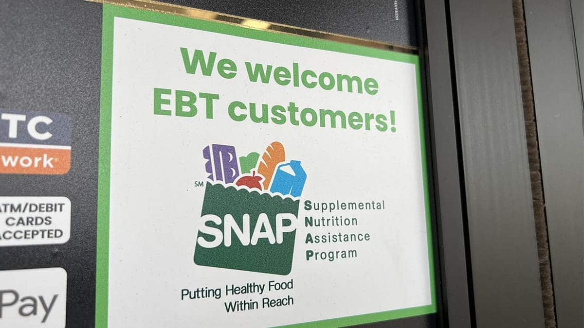 Sign at supermarket entrance with text reading We Welcome EBT customers and a SNAP logo in Lafayette, California, November 13, 2025.