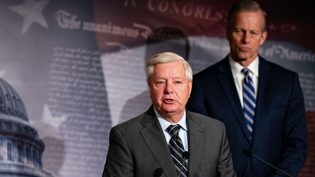 Lindsey Graham and John Thune speak during a news conference in Washington, D.C.