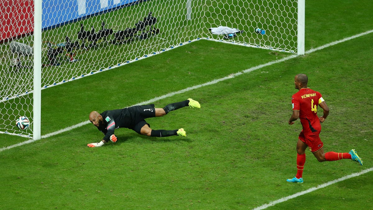 SALVADOR, BRAZIL - JULY 01: Vincent Kompany of Belgium has his shot saved by Tim Howard of the United States during the 2014 FIFA World Cup Brazil Round of 16 match between Belgium and the United States at Arena Fonte Nova on July 1, 2014 in Salvador, Brazil. (Photo by Robert Cianflone/Getty Images)