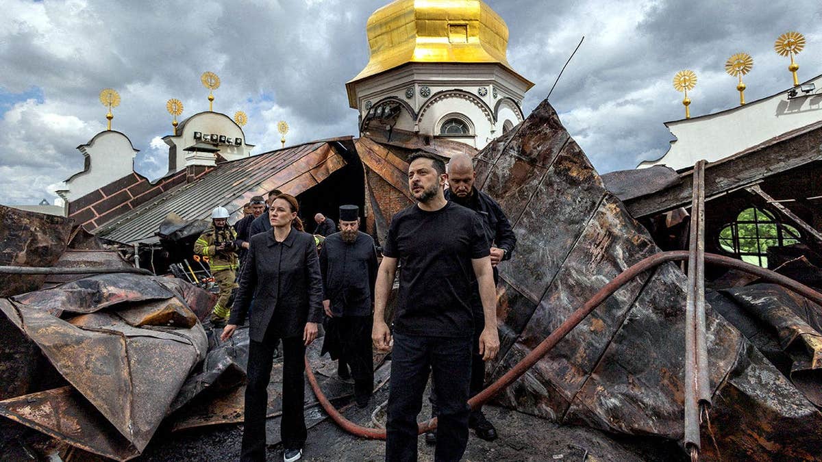 Ukraine's President Volodymyr Zelenskyy and Ukrainian Prime Minister Yulia Svyrydenko walking
