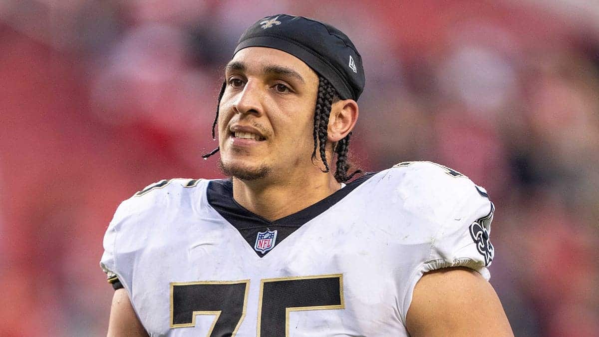 Andrus Peat stands on the field after the Saints-49ers game at Levi's Stadium.