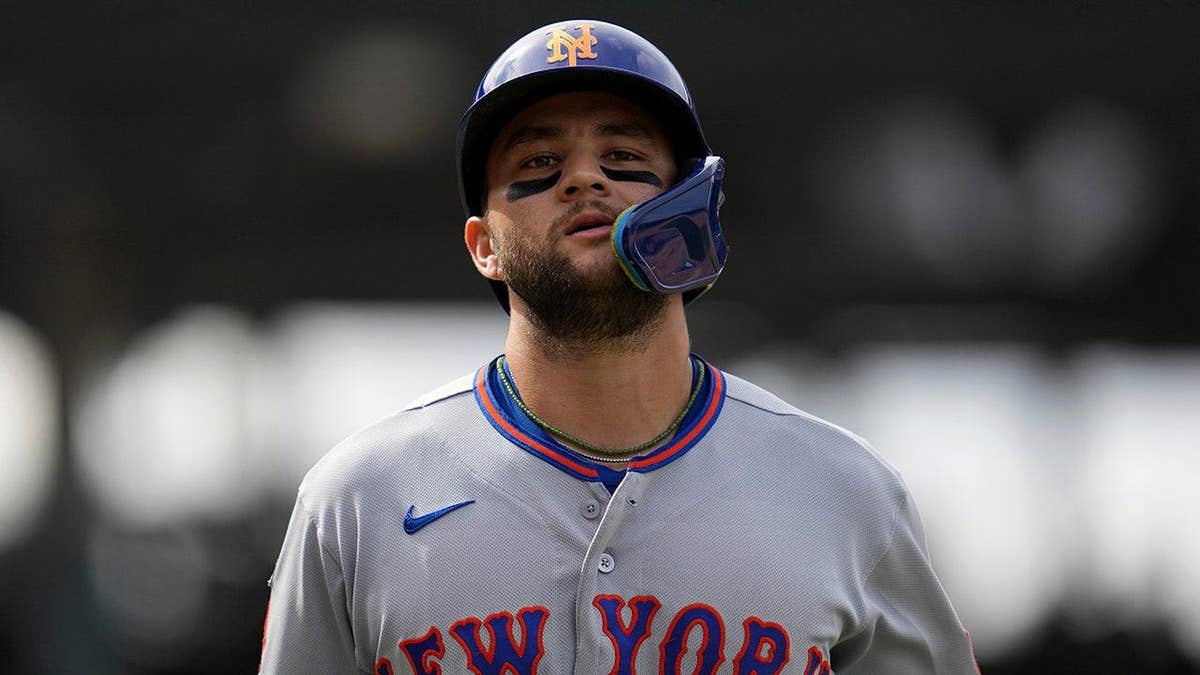 New York Mets' Bo Bichette leaving the field during a baseball game in Chicago
