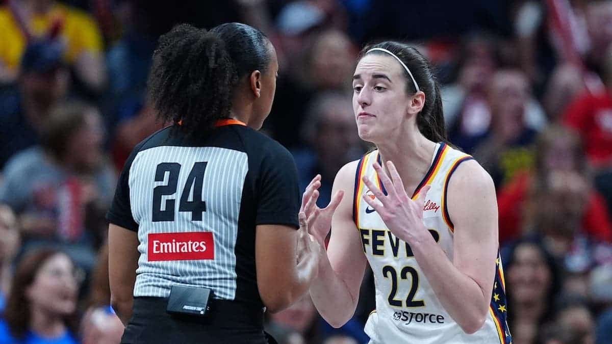 Caitlin Clark gestures at a referee during a game at Gainbridge Fieldhouse.