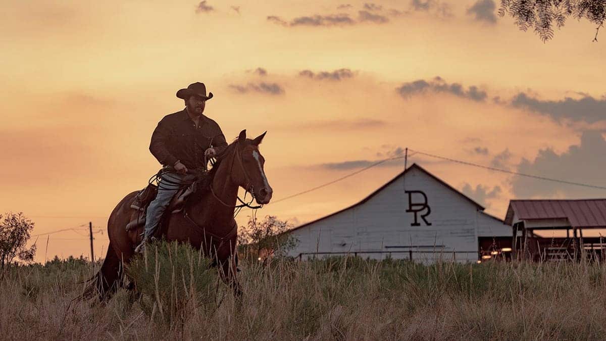 Cole Hauser as Rip Wheeler riding a horse at Dutton Ranch.