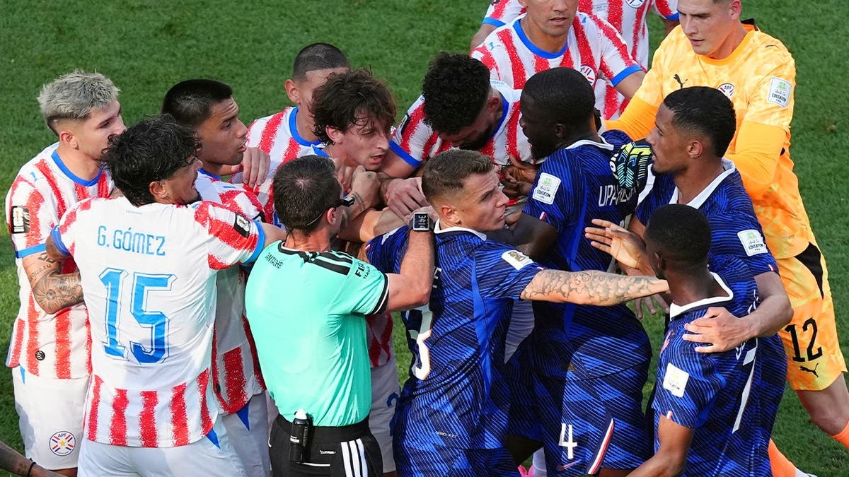 France and Paraguay players shoving