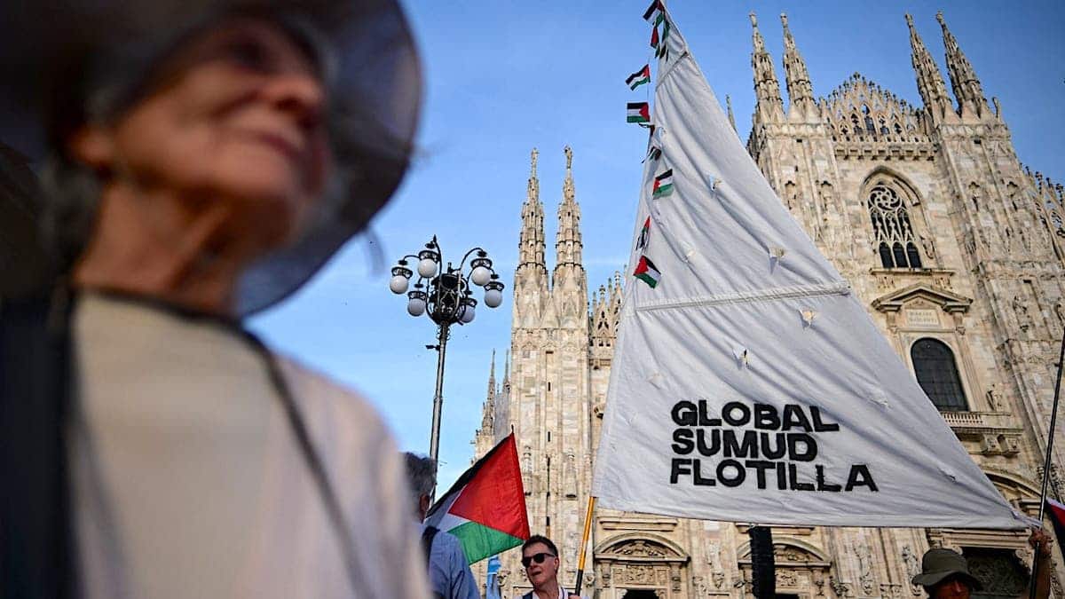 People participate in a flash mob protest in Milan against detention of Global Sumud Flotilla activists.