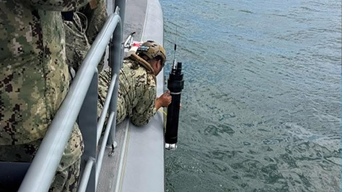 us army soldier holding weapon overseas