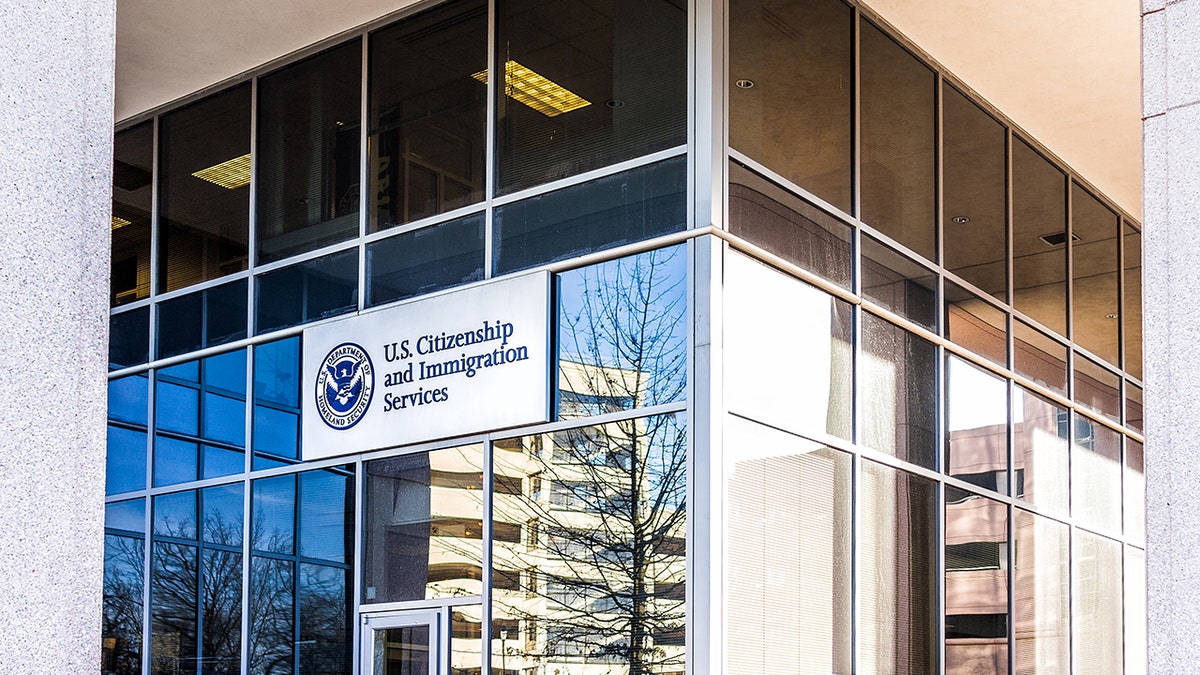 USCIS US United States Citizenship and Immigration Services field main office entrance in Virginia with sign