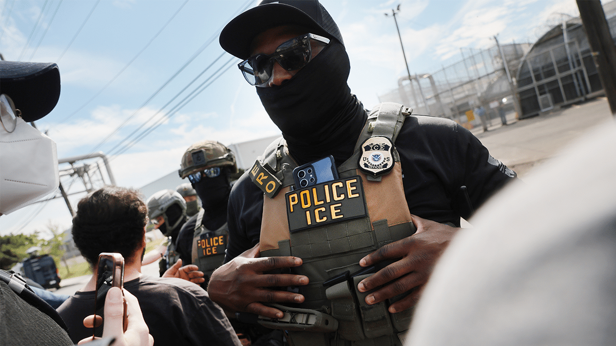 ICE agents outside Delaney Hall